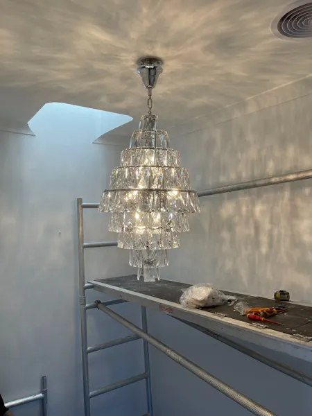Illuminated tiered crystal pendant light